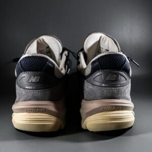 Close-up of New Balance sneakers showcasing details and branding with a focus on craftsmanship.
