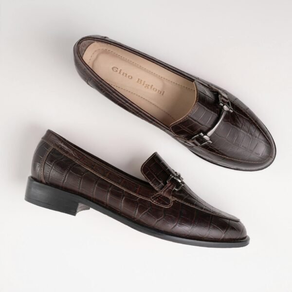 Stylish brown leather loafers with croc-embossed pattern on a white background.